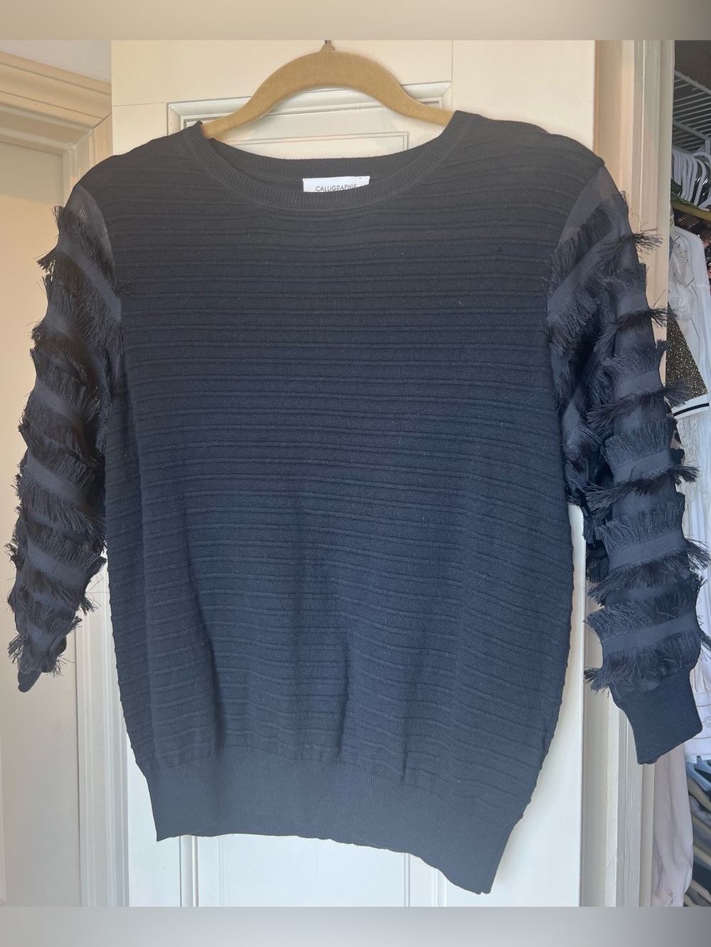 Calligraphie Black Knit Top with Fringe Sleeve Detail